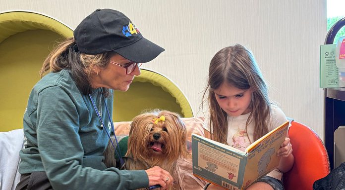 Reading to a dog at Healdsburg Library