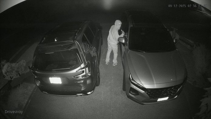 Surveillance camera image of car theft in progress