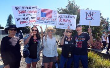 No KIngs protestor holding signs