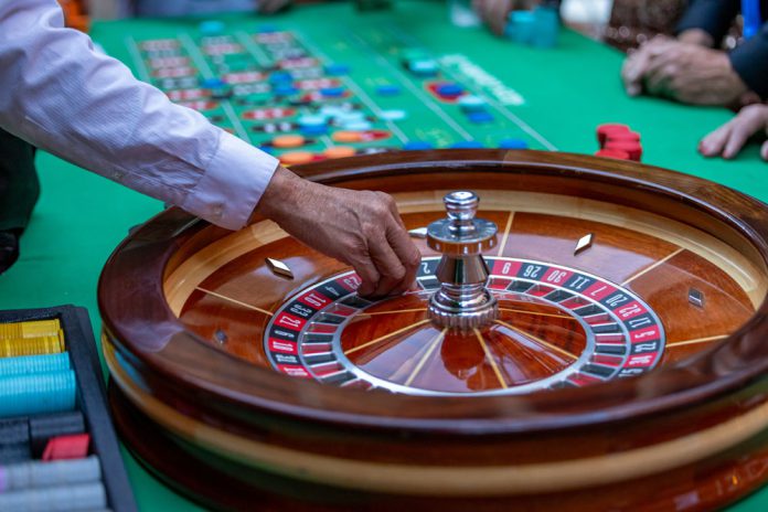 California crypto crackdown sparks interest in crypto gambling Man in casino playing roulette