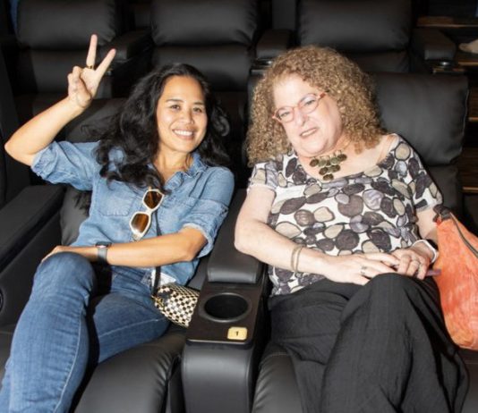 Happy filmgoers await the previews.