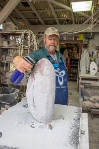Spraying water on a stone