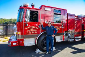 Fire Chief Jason Boaz with department ladder truck.