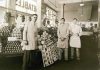 Staff of Jay Hassert's fruit and vegetable market, house, 1930s.