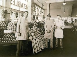 Staff of Jay Hassert's fruit and vegetable market, house, 1930s.