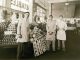 Staff of Jay Hassert's fruit and vegetable market, house, 1930s.