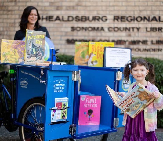 Library’s ‘BiblioBike’ gets national recognition young reader at Healdsburg biblio-bike
