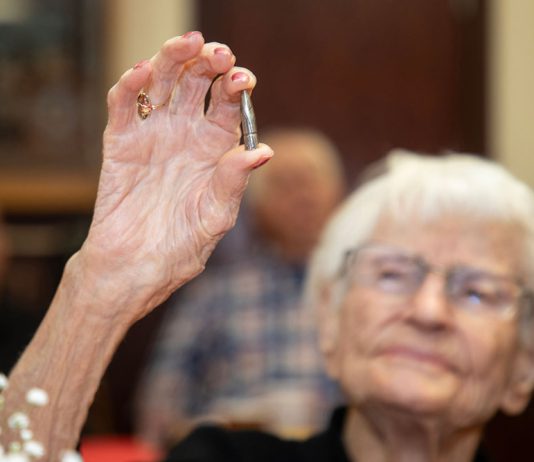 Veterans bring out their best Alice Beck Darrow, 106 years old, holds aloft a silver bullet.