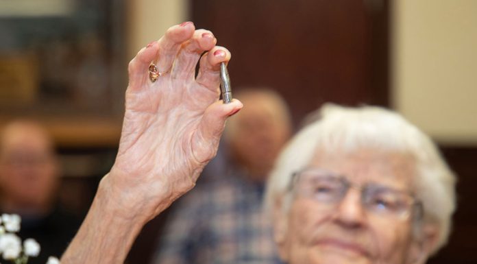 Veterans bring out their best Alice Beck Darrow, 106 years old, holds aloft a silver bullet.