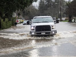 truck on north street in flood