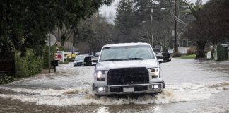 truck on north street in flood