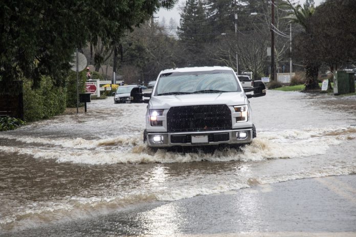 truck on north street in flood