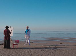 Artist and subject at the sea