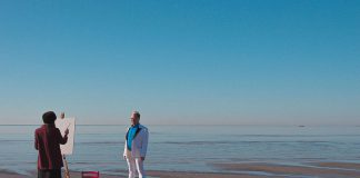 Artist and subject at the sea