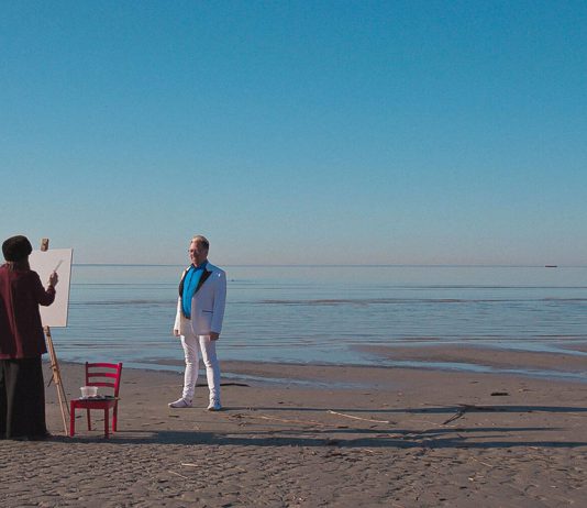 Artist and subject at the sea