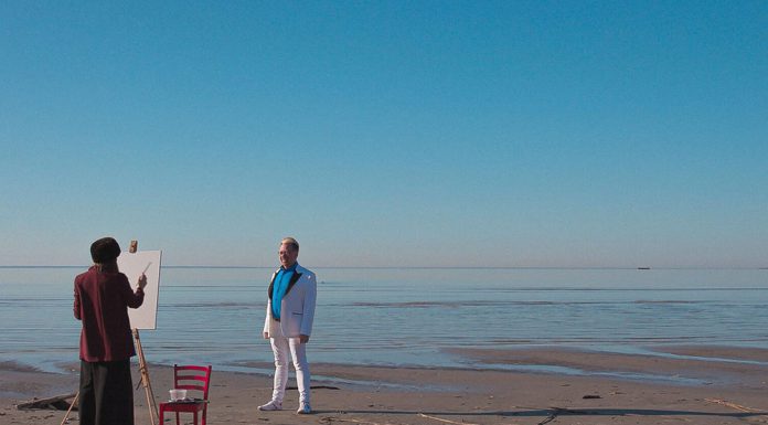 Artist and subject at the sea