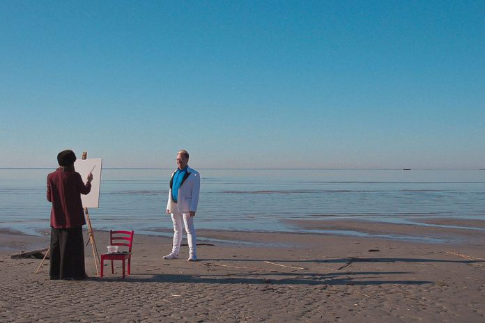 Artist and subject at the sea